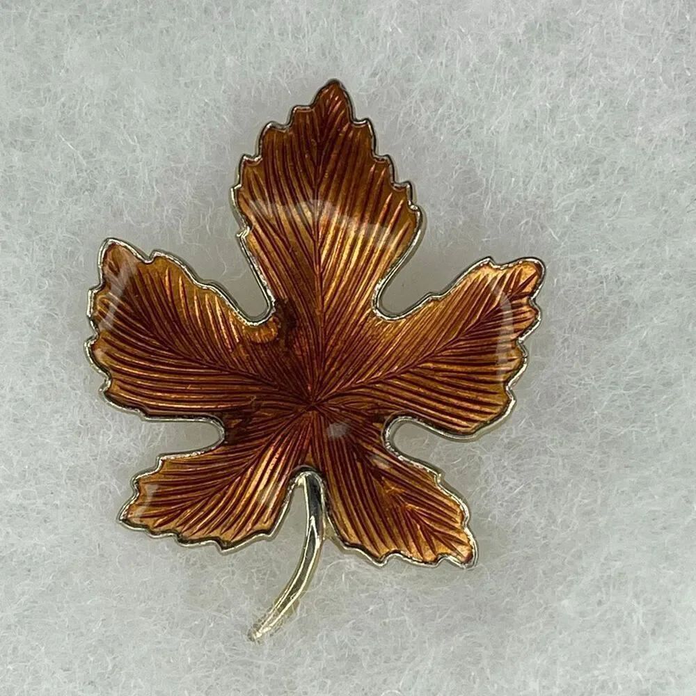 Vintage enamel maple leaf brooch.